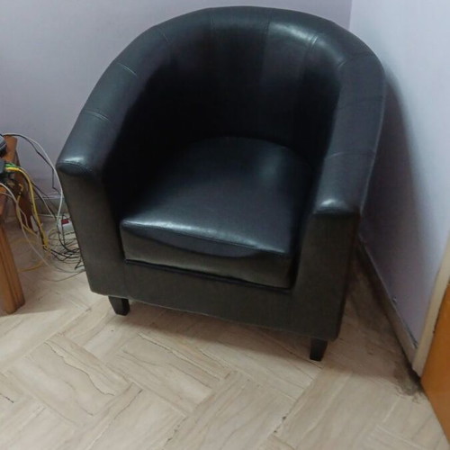 Black leatherette 2-seater sofa, 2 armchairs and 2 IKEA tables