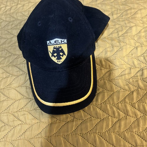 AEK Champions League hat used, adjustable, black and yellow