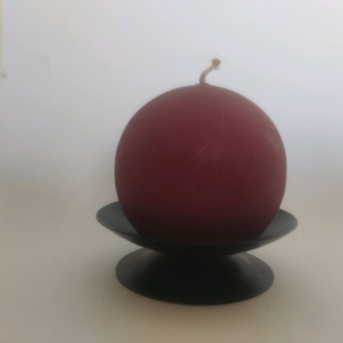 Round candle on metal black base like new