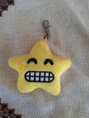 Star smiley fabric keychain like new, yellow plush emoji