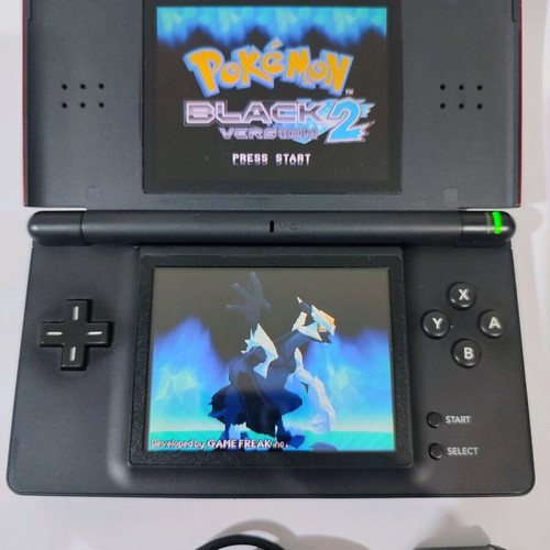 Nintendo DS Lite console used with Pokemon LeafGreen cartridge and accessories