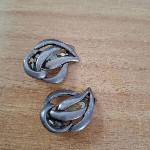 Vintage metal earrings used with abstract artistic design silver
