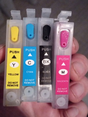 Refillable ink cartridges compatible with Epson printers like new, set of 4