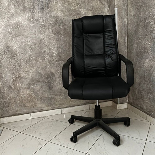 Black executive office chair with armrests and wheels