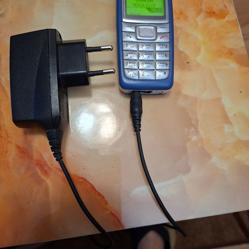 Nokia 1110i used, gray phone with charger