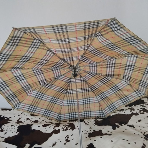 Vintage unisex folding umbrella with wooden handle, used