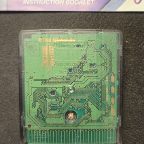 The Legend of Zelda Oracle of Ages Game Boy Color cartridge and manual