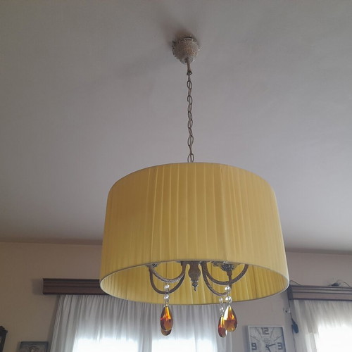 Ceiling light with brass parts and yellow lampshade