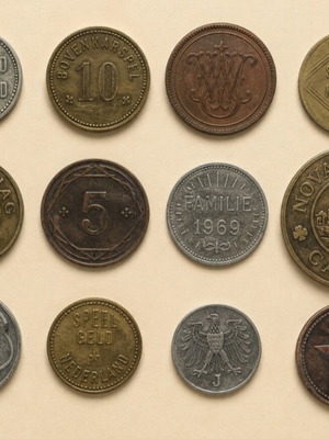 Collectible lot of 12 old tokens and Spielgeld coins