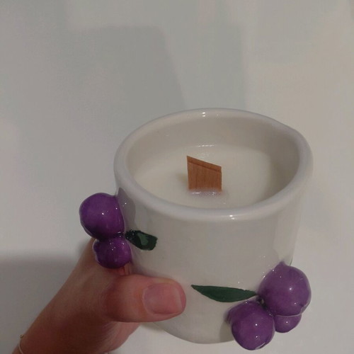 Soy candle with sandalwood scent in handmade ceramic cup
