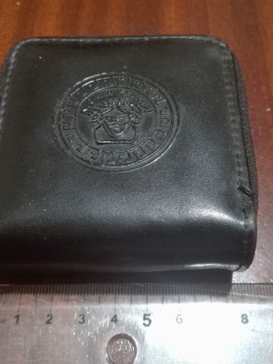 Square wallet like new made of leatherette with two compartments