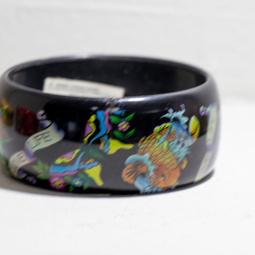 Ed Hardy black acrylic bangle bracelet with “Love Life Skull Rose Dragon” design like new