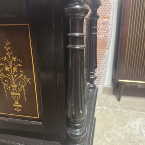 Vintage wooden cabinet used with decorative gold inlay