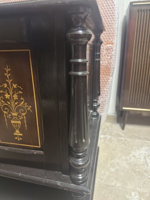 Vintage wooden cabinet used with decorative gold inlay