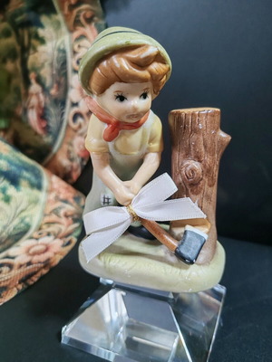 Bisque porcelain figure like new, young boy chopping wood