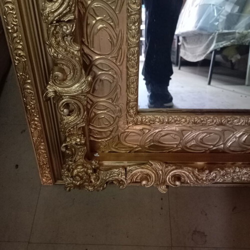 Vintage retro mirror with carved ornate gold frame used
