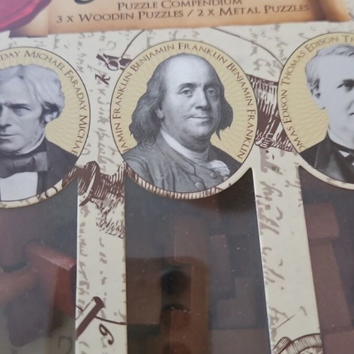 Great Minds Puzzle Set of 5 like new, 3 wooden and 2 metal puzzles