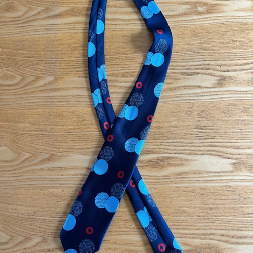 Vintage men's tie blue with geometric polka dots, retro style