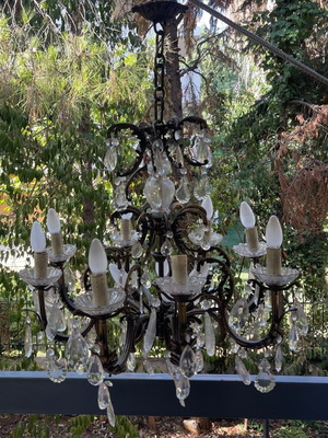 Antique chandelier used with bronze and crystal