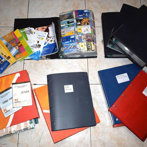 Collection of used 2307 phone cards with holders