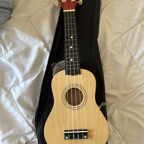 Ukulele like new with torn bag