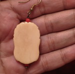 Vintage Laughing Buddha earrings, cream with red beads