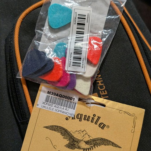 Ukulele new with case, new strings and picks