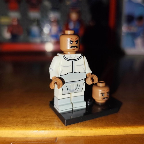 Lucan minifigure like new with base and extra head