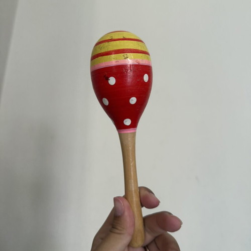 Wooden children's musical instrument used with paint wear