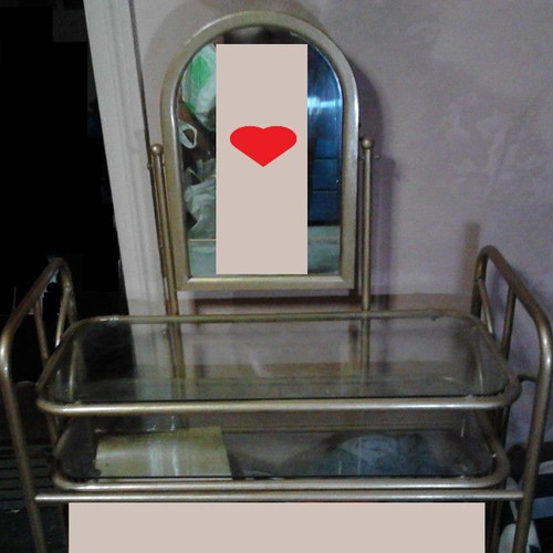 Metal vanity with mirror and two glass shelves used