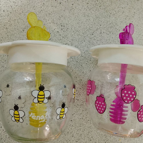 Set of 2 glass honey jars with bee and strawberry designs