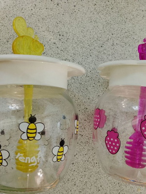 Set of 2 glass honey jars with bee and strawberry designs