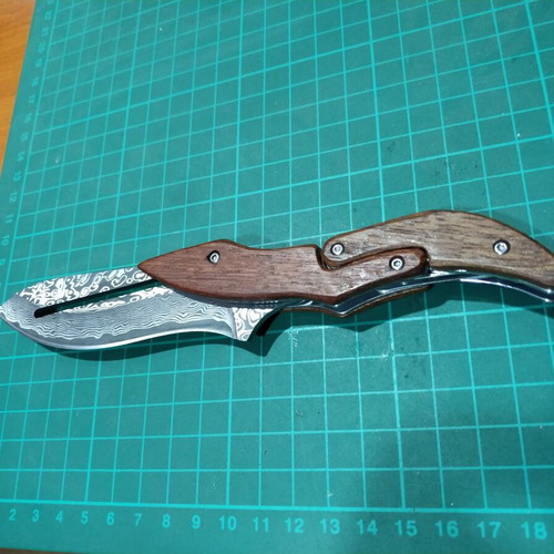 Folding knife with opening mechanism and Laser Pattern Damascus blade, like new