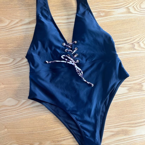 Black one-piece swimsuit with animal print cord, size L, like new