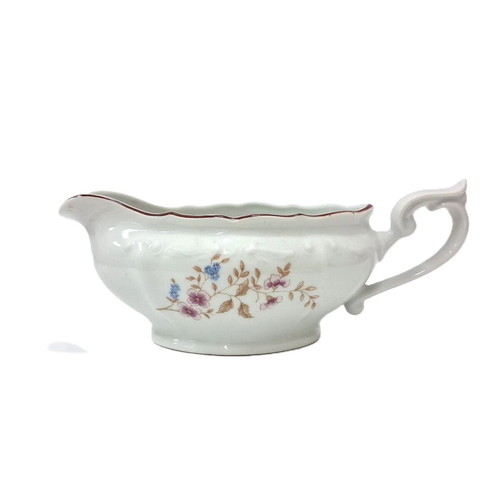 Vintage porcelain sauceboat with floral motif like new