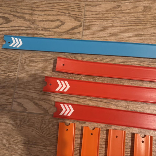 Hot Wheels track set with orange straight and colored action pieces