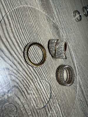 Set of 3 rings like new, gold color with stones