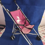 Toy stroller like new, lightweight and foldable