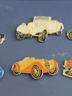 Collection of used pins with old collectible cars