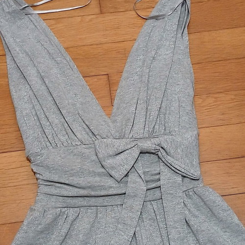 Dress gray silver with V neckline and bow tie at waist size Medium like new