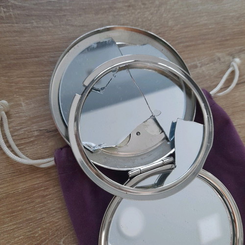 Compact mirror for bag used with purple velvet pouch