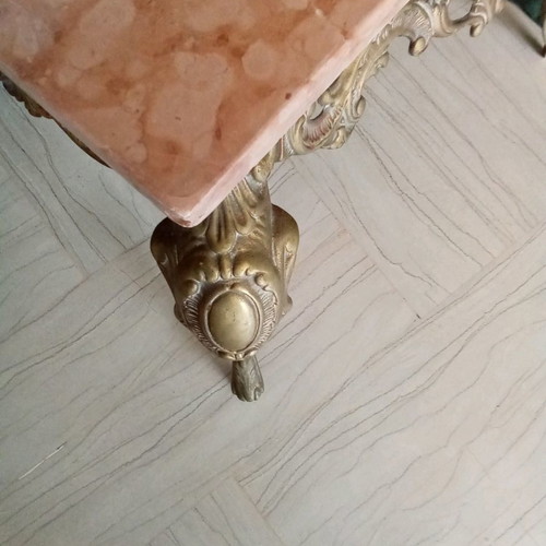 Bronze coffee table used with pink marble