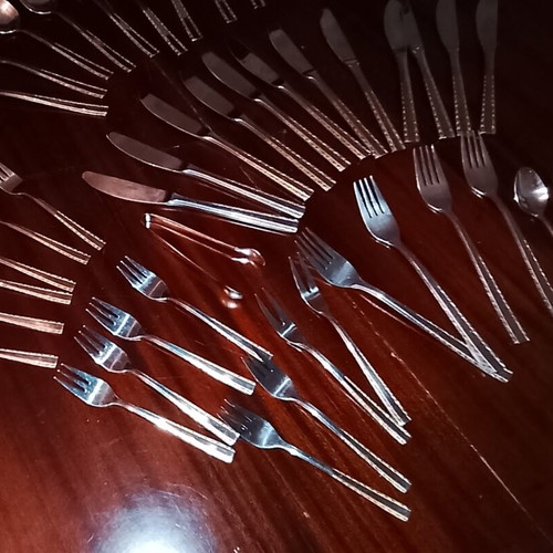 Solingen cutlery set incomplete with gold border on handles, used
