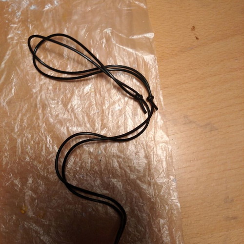 Butterfly necklace like new with liquid glass and rubber cord