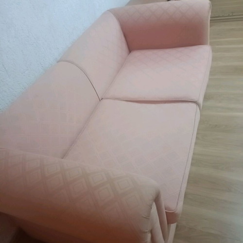 Vintage two-seater sofa used, salmon color in very good condition