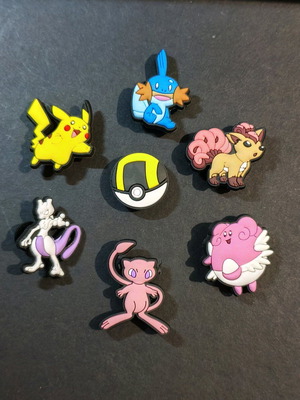 Pokémon Crocs Charms set like new, pink multicolor