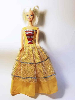 Doll used with scratches and torn clothes, no shoes