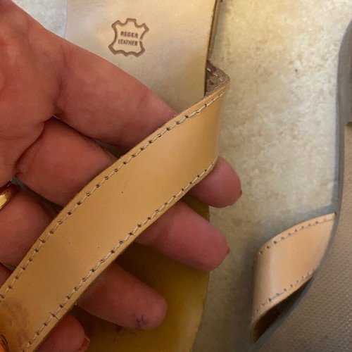 Leather sandals used with orange glass bead flower