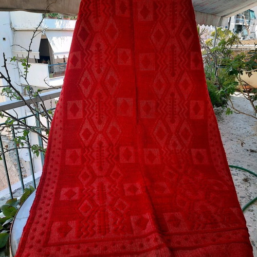 Handmade wool blanket used in red color