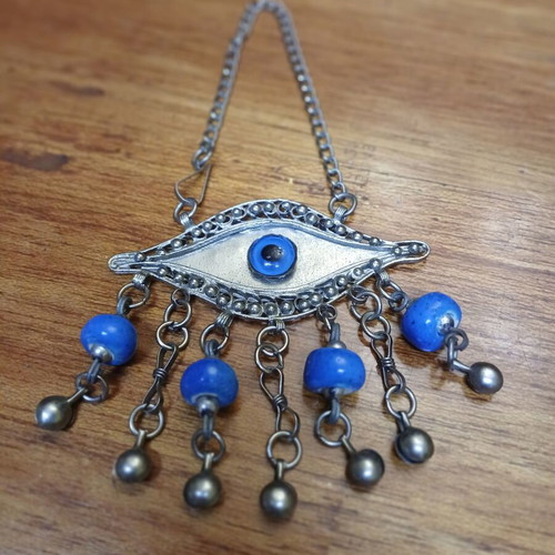 Vintage metal evil eye decoration used, silver with blue beads